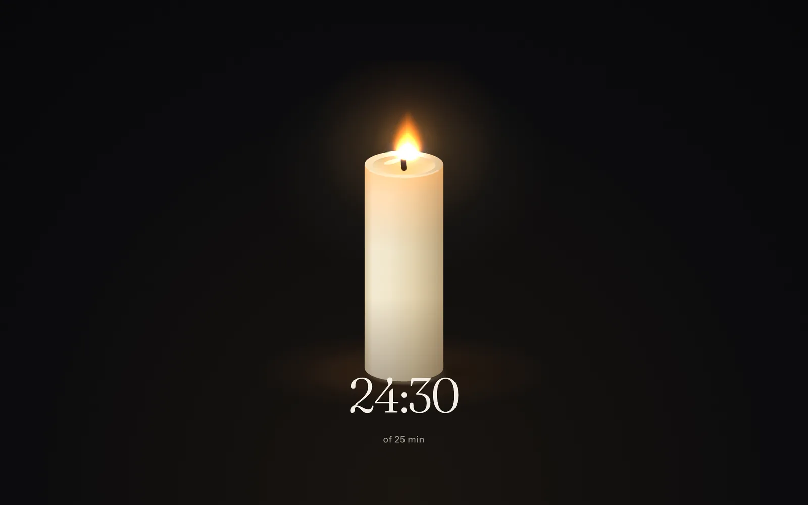 A candle burning on a black screen