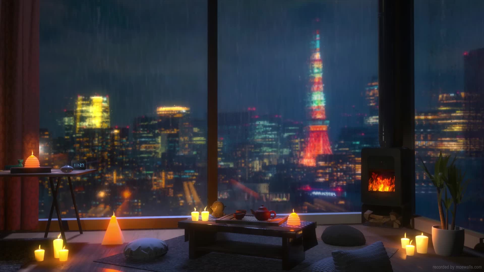 Candles and a wood stove by a rain-streaked window over Tokyo at night