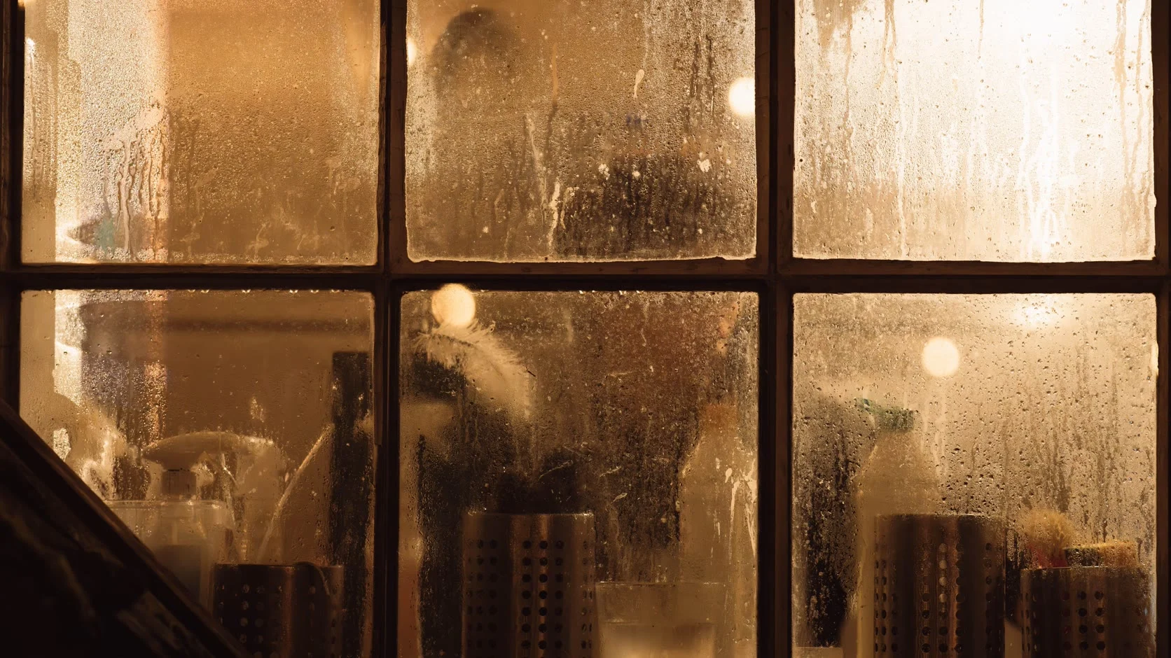 Warm light through a steamed-up window